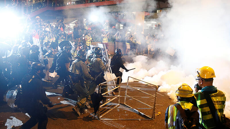 Riot police clash with anti-extradition demonstrators, after a march to call for democratic reforms in Hong Kong