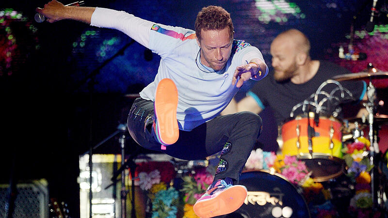Chris Martin of the Coldplay performs during the One Love Manchester benefit concert for the victims of the Manchester Arena terror attack at Emirates Old Trafford