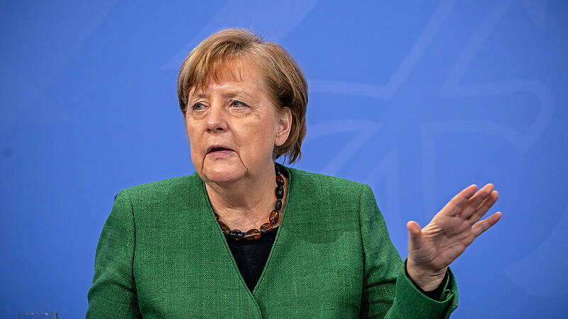 German Chancellor Angela Merkel attends a news conference after discussing COVID-19 lockdown extension with state premiers