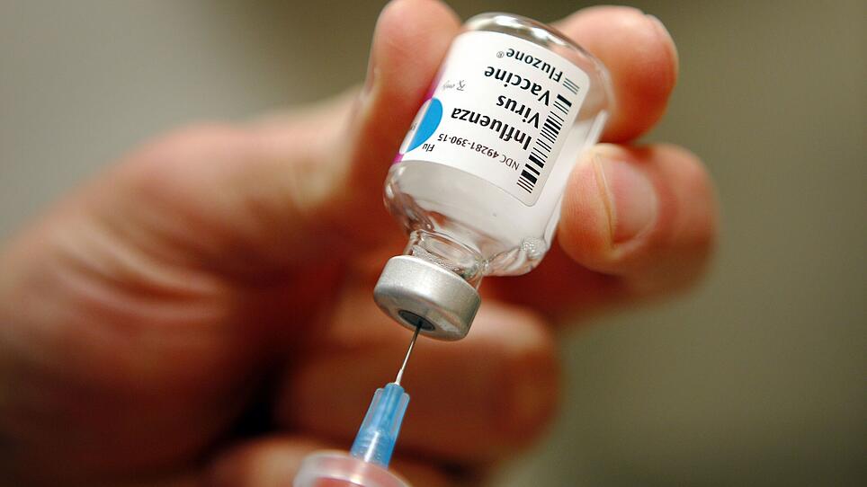 A nurse prepares an injection of the influenza vaccine at Massachusetts General Hospital in Boston, Massachusetts