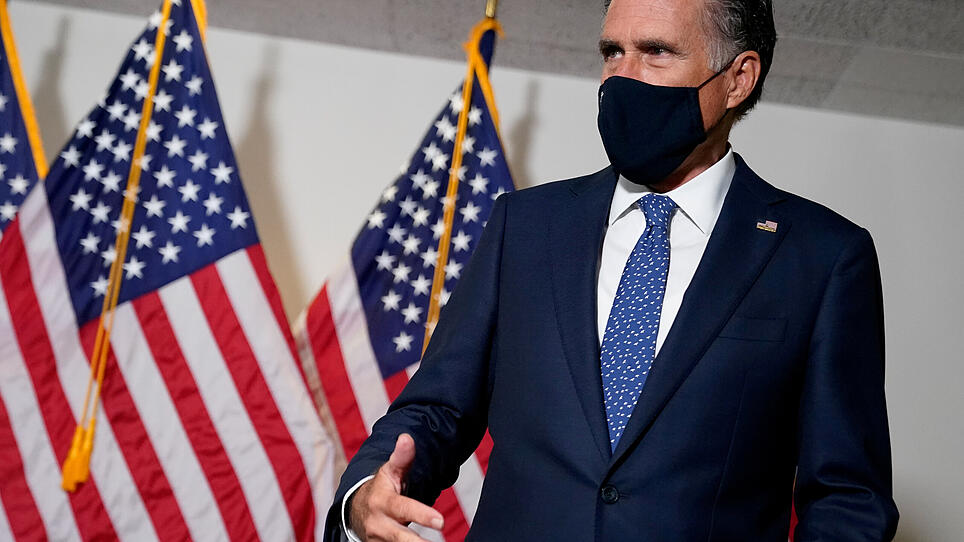 FILE PHOTO: U.S. Senator Mitt Romney arrives at a luncheon on Capitol Hill