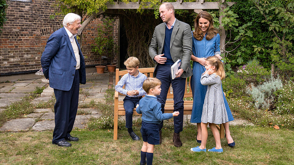 A handout photo released by Britain's Prince William and Cathrine, Duchess of Cambridge, Prince George, Princess Charlotte and Prince Louis with David Attenborough, in London