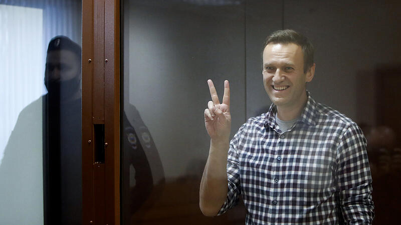 Russian opposition leader Alexei Navalny hearing to consider an appeal against an earlier court decision to change his suspended sentence to a real prison term