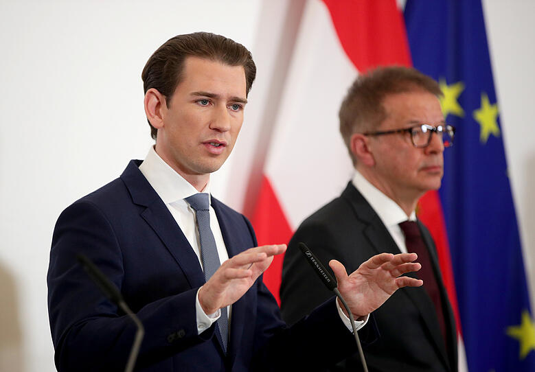 Austrian Chancellor Sebastian Kurz and Health Minister Rudolf Anschober attend a news conference in Vienna
