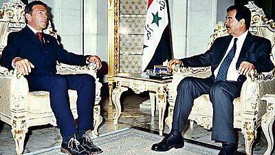 Haider im Jahr 2002 bei Saddam Hussein