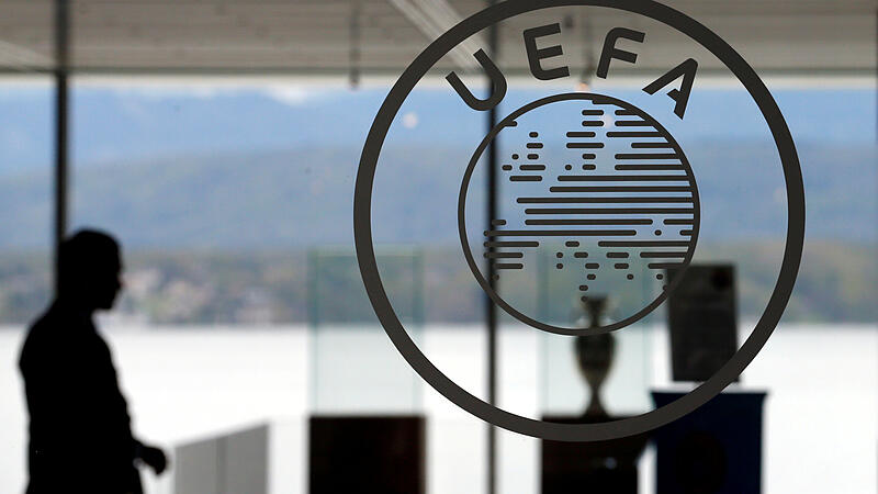 FILE PHOTO: A logo is pictured on UEFA headquarters in Nyon