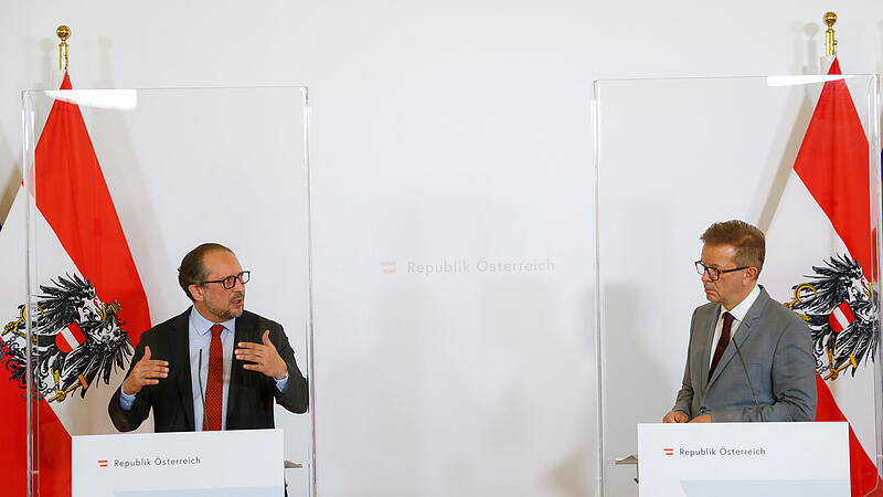 Austrian Foreign Minister Schallenberg and Health Minister Anschober address a news conference in Vienna