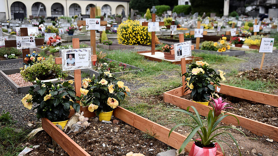 FILE PHOTO: Graves of people who had recently died due to COVID-19 are seen at the cemetery of Nembro, near Bergamo