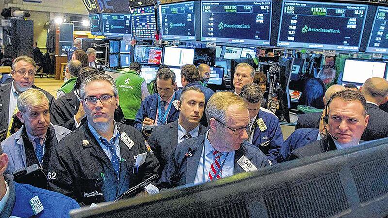 Traders works on the floor of the New York Stock Exchange