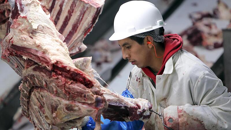 A Cargill employee trims beef at the Cargill Beef Processing Plant in Schuyler