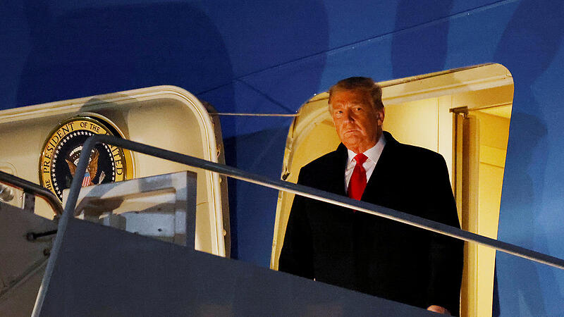 FILE PHOTO: U.S. President Donald Trump disembarks from Air Force One at Joint Base Andrews in Maryland