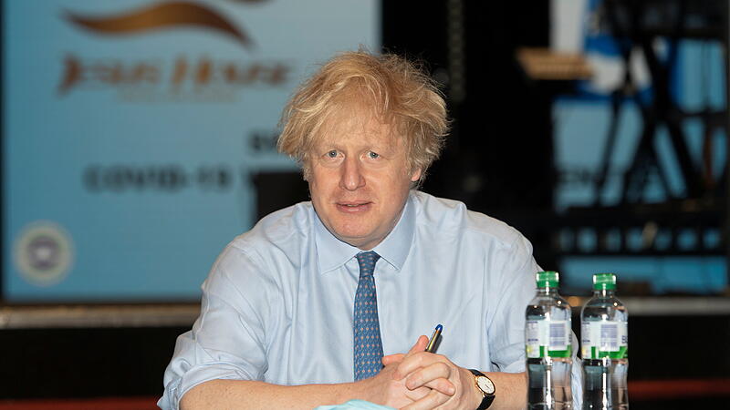 Britain's Prime Minister Boris Johnson visits a COVID-19 vaccination centre, in London