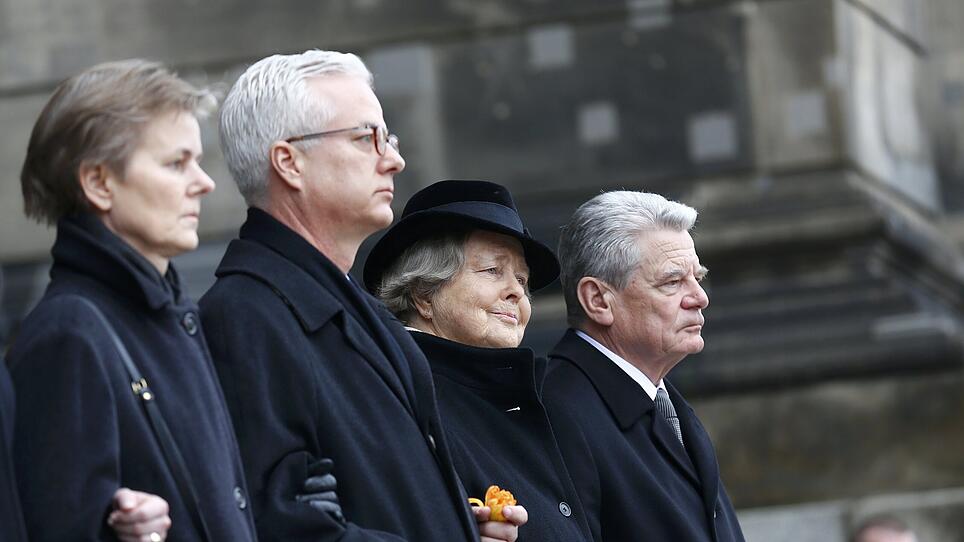 Widow Marianne von Weizsaecker and German President Gauck leave after a church service to commemorate former German President von Weizsaecker in Berlin