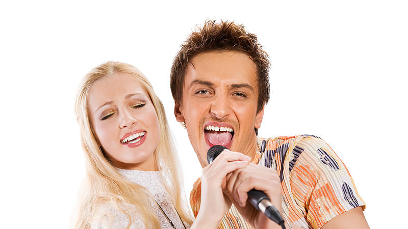 Attractive young couple singing
