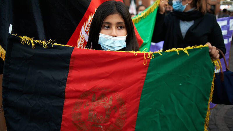 Toulouse: Gathering In Support Of Girls And Women In Afghanistan An Afghnai girl holds the national flag of Afghanistan.