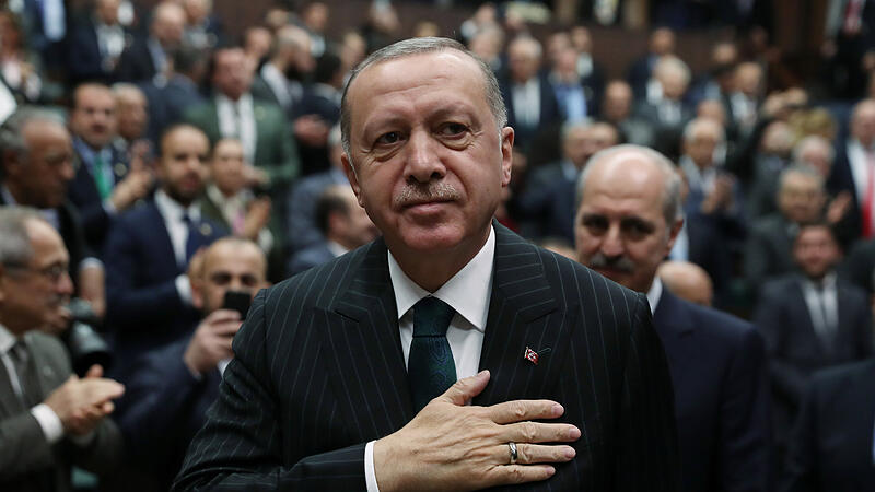 Turkish President Erdogan greets members of his AK Party in Ankara