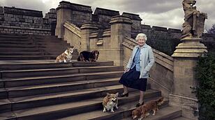 Britain's Queen Elizabeth II is seen walking in the private grounds of Windsor Castle on steps at the rear of the East Terrace and East Garden with four of her dogs