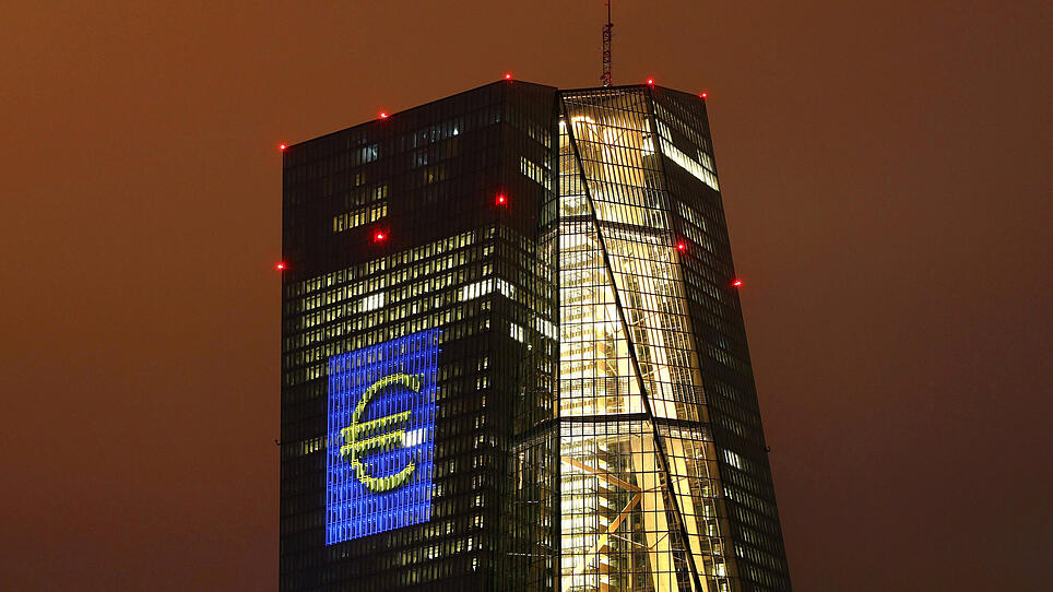 Headquarters of the European Central Bank (ECB) is seen illuminated with a giant euro sign at the start of the "Luminale, light and building" event in Frankfurt