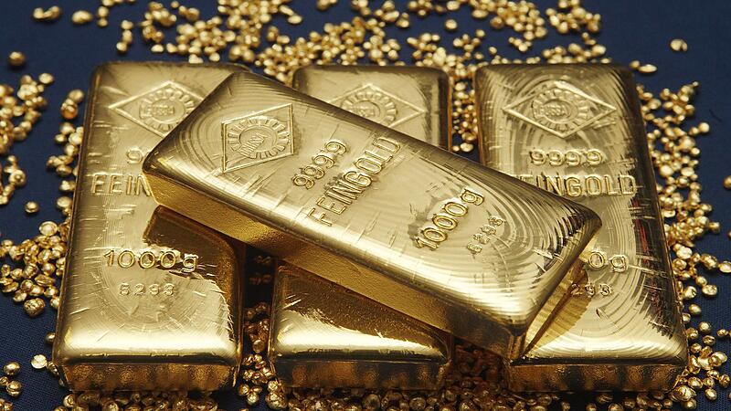 Gold bars and granules are pictured at the Austrian Gold and Silver Separating Plant 'Oegussa' in Vienna