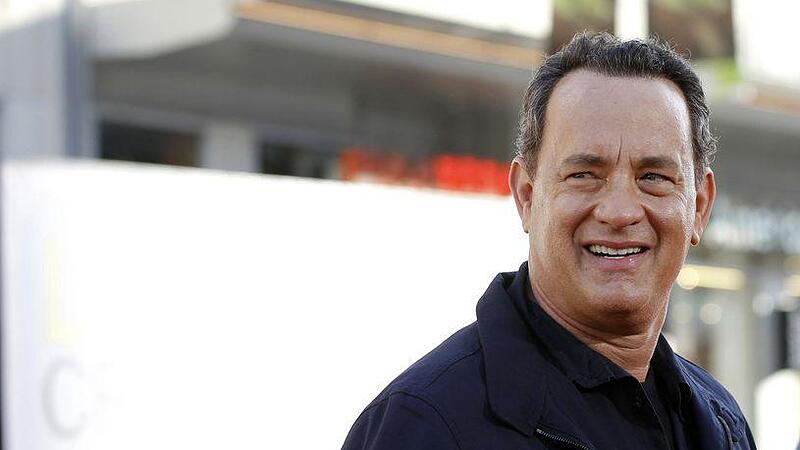 Hanks poses at the world premiere of "Larry Crowne" at the Chinese theatre in Hollywood